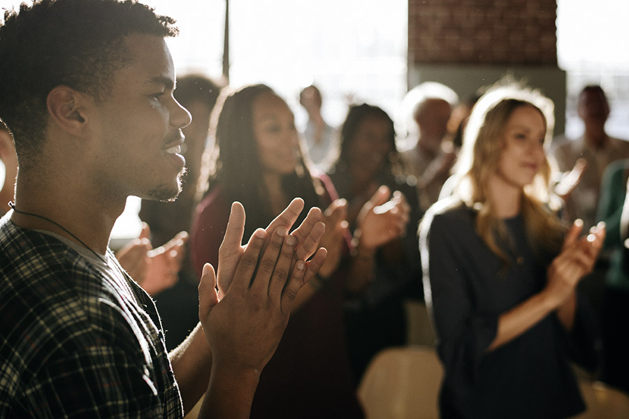 Diverse people clapping after a session